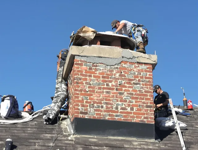 Plainfield Chimney Sweep installing a custom chimney crown in Plainfield, CT
